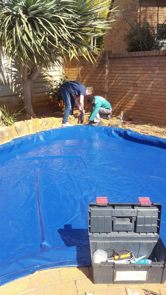 pool safety net specialist installing pool safety cover